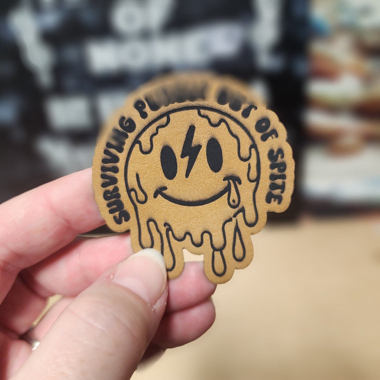 Surviving Out of Spite (Saddle Tan) Engraved Leatherette Hat Patch - MR01 - LoneStar Adhesive