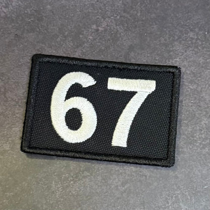 67 -Six Seven- Funny Morale Patch, 2x3" | Made in USA | VELCRO® Brand Hook Backing