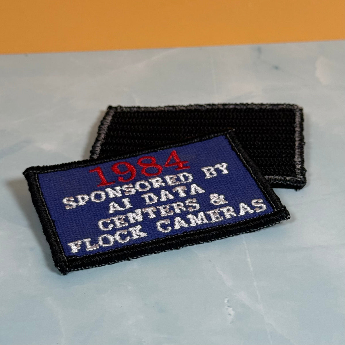 1984 - Sponsored by AI Data Centers & Flock Cameras Funny Morale Patch, 2x3" | Made in USA | VELCRO® Brand Hook Backing