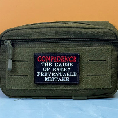 Confidence Causes Mistakes Funny Morale Patch, 2x3" | Made in USA | VELCRO® Brand Hook Backing