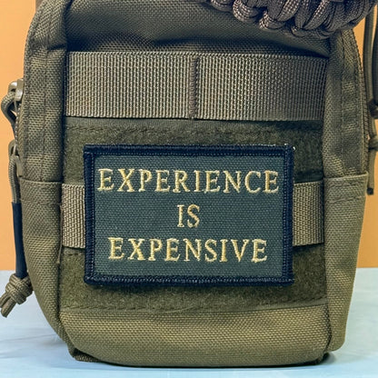 Experience Is Expensive Funny Tactical Morale Patch, 2x3" | Made in USA | VELCRO® Brand Hook Backing