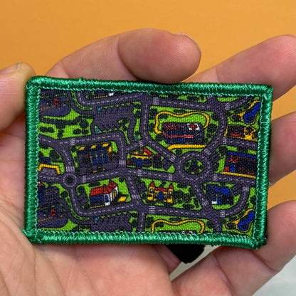 Retro Toy Car Pay Rug Carpet Funny Morale Patch, 2x3" | Made in USA | VELCRO® Brand Hook Backing