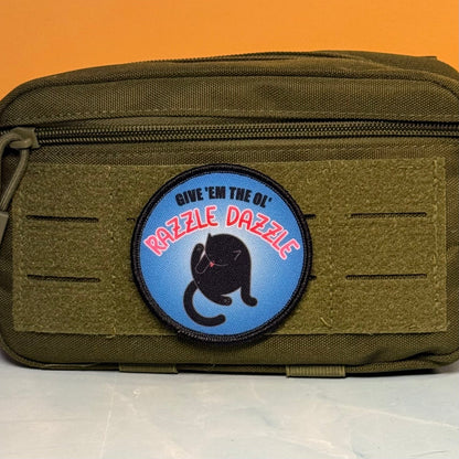 Give 'Em The Razzle Dazzle Funny Printed Morale Patch, 3" Round | VELCRO® Brand Hook Backing