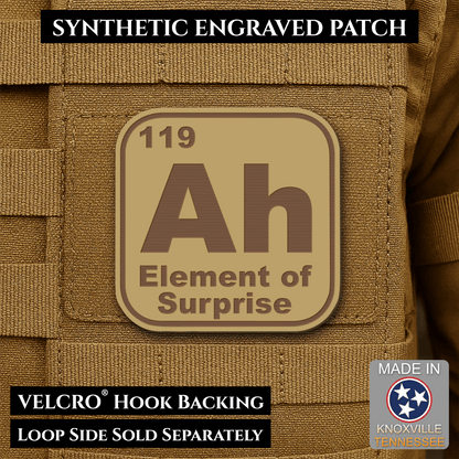 Front design and hook backing of Ah, The Element of Surprise patch in desert tan / brown
