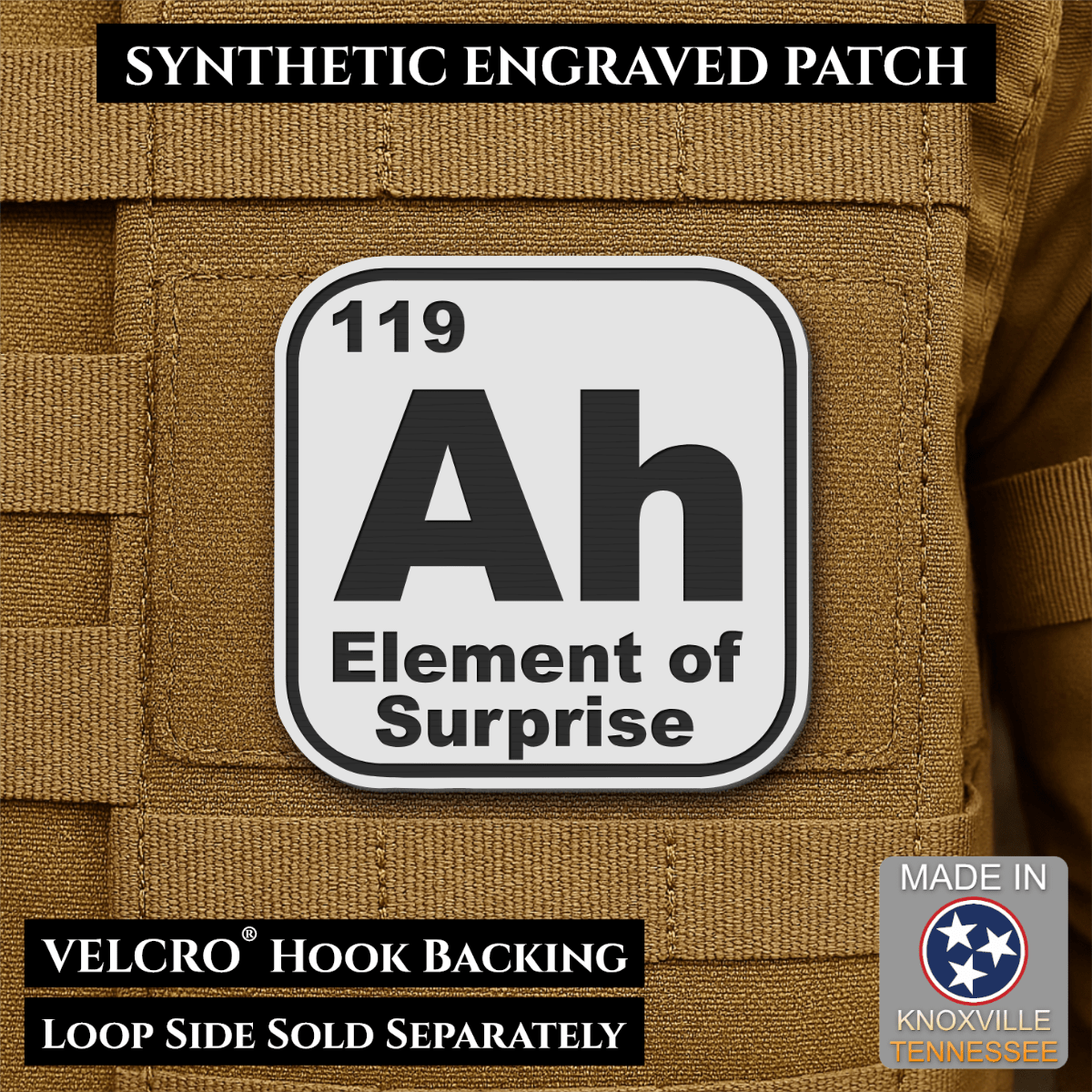 Front design and hook backing of Ah, The Element of Surprise patch in white