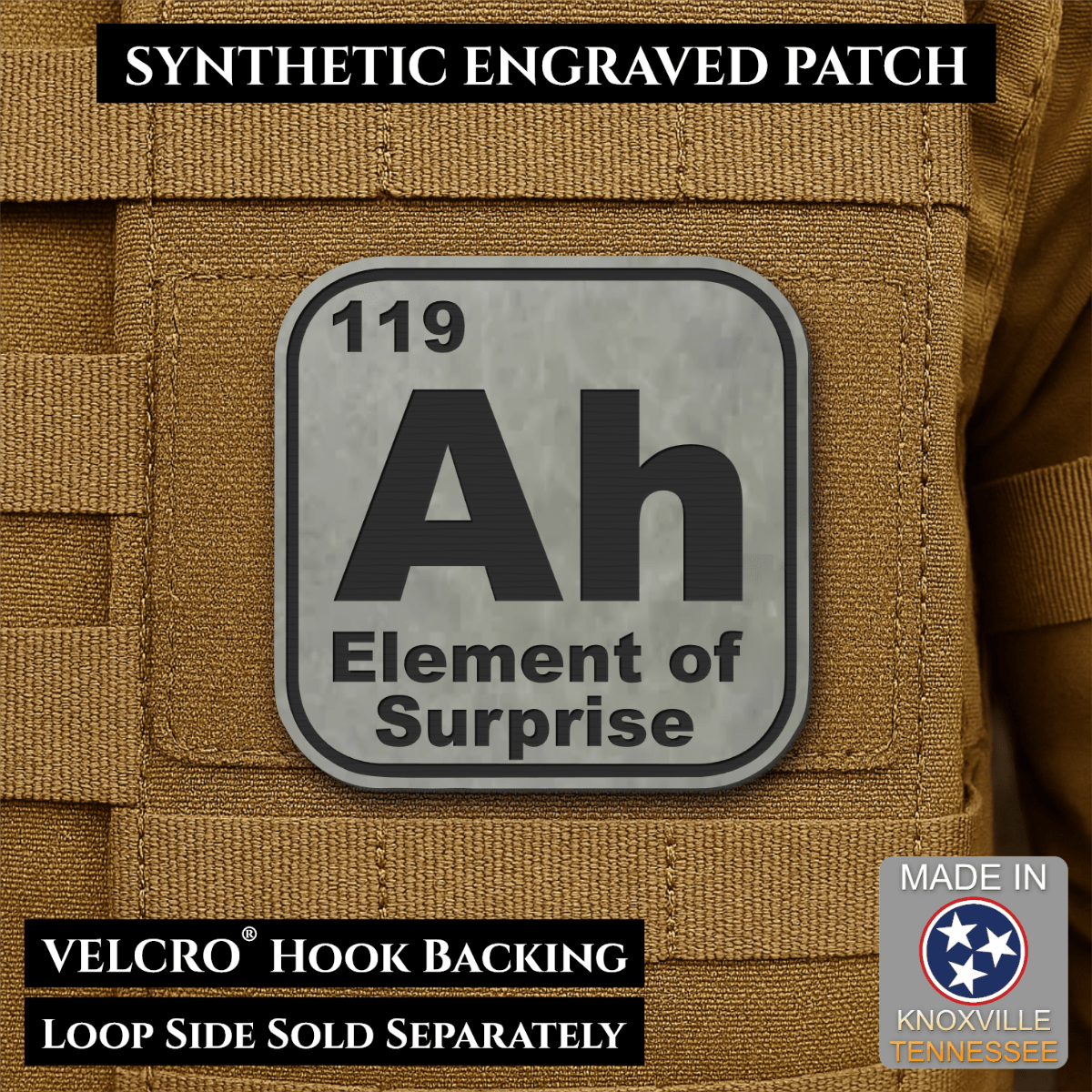 Front design and hook backing of Ah, The Element of Surprise patch in flint gray