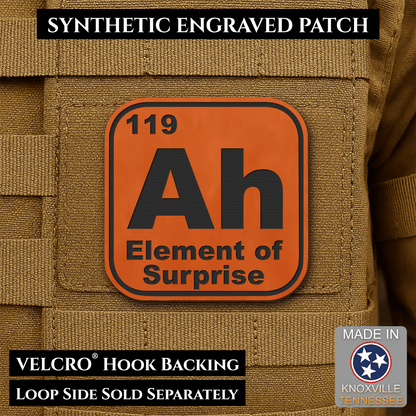 Front design and hook backing of Ah, The Element of Surprise patch in orange