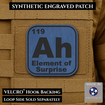 Front design and hook backing of Ah, The Element of Surprise patch in indigo blue