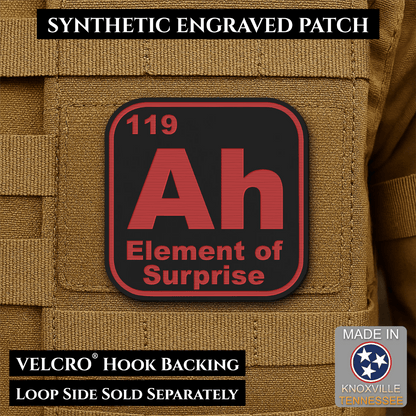 Front design and hook backing of Ah, The Element of Surprise patch in black / red