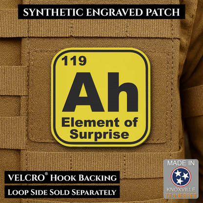 Front design and hook backing of Ah, The Element of Surprise patch in yellow