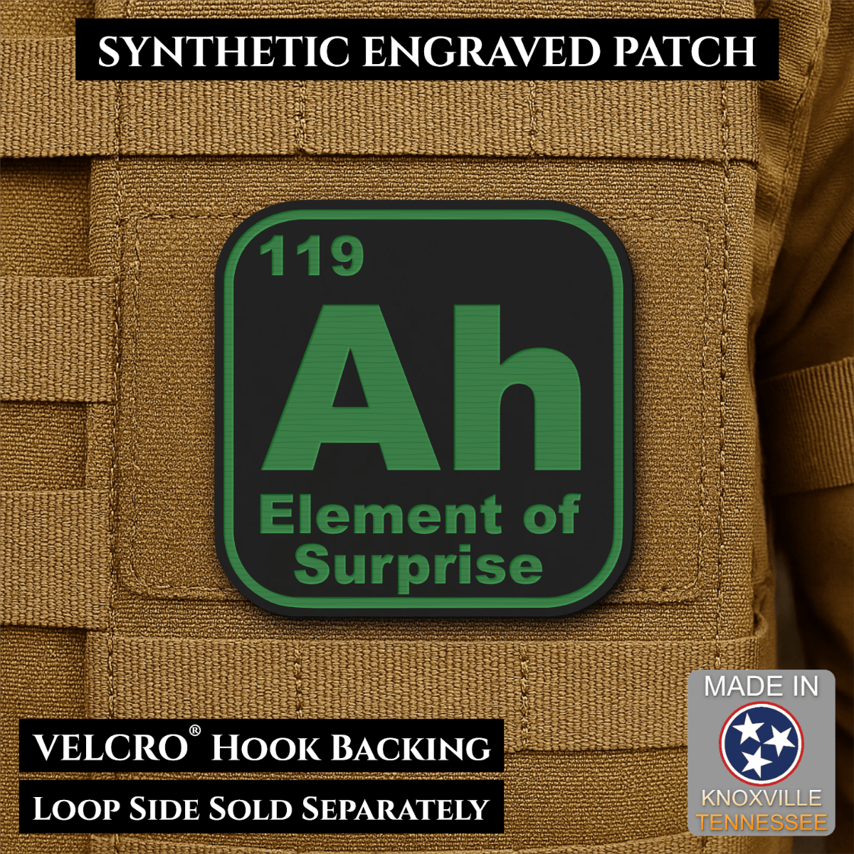 Front design and hook backing of Ah, The Element of Surprise patch in black / green