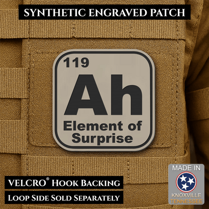 Front design and hook backing of Ah, The Element of Surprise patch in sand (light tan)