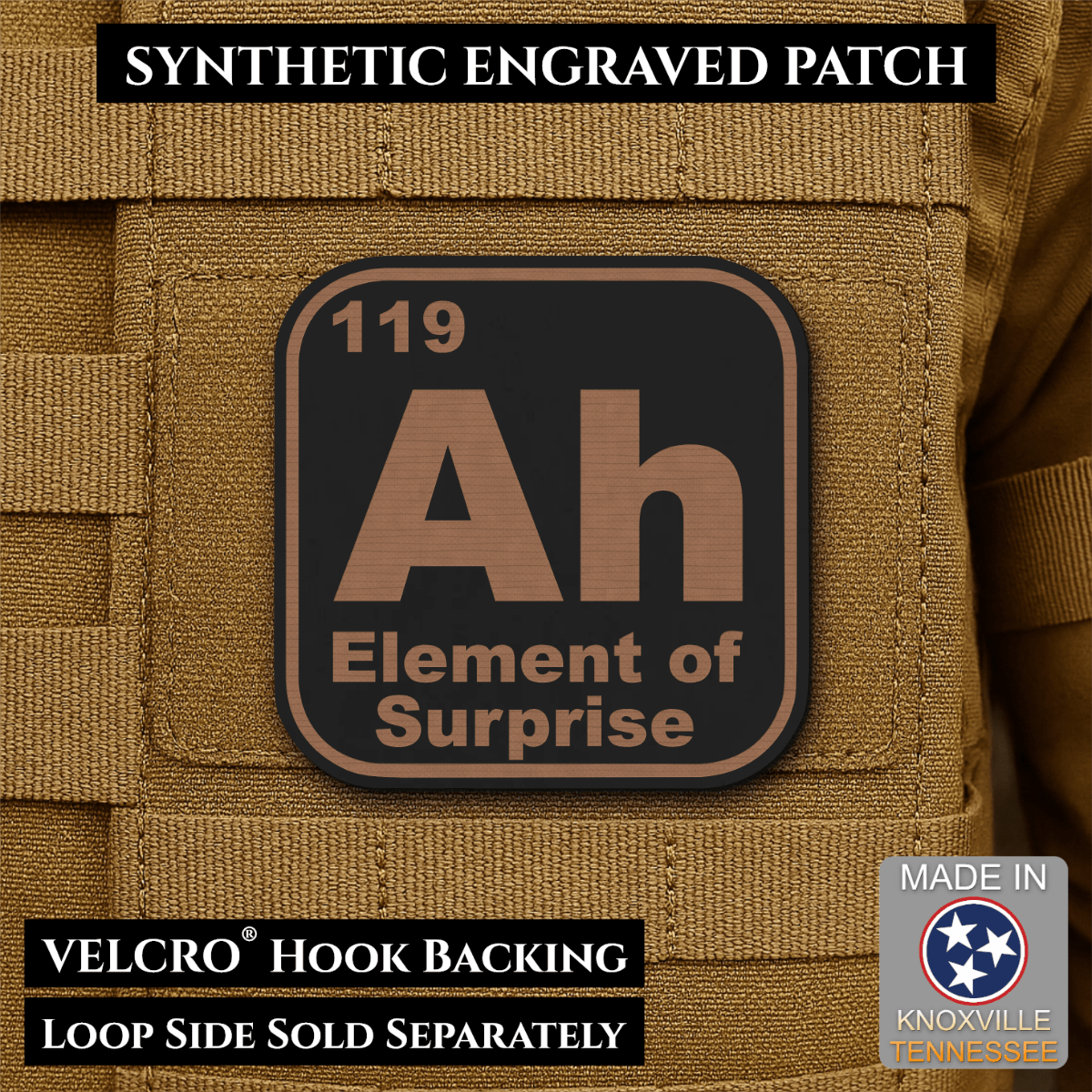 Front design and hook backing of Ah, The Element of Surprise patch in black / copper