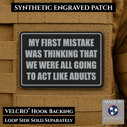 Front design and hook backing of Can We Act Like Adults patch in black / silver