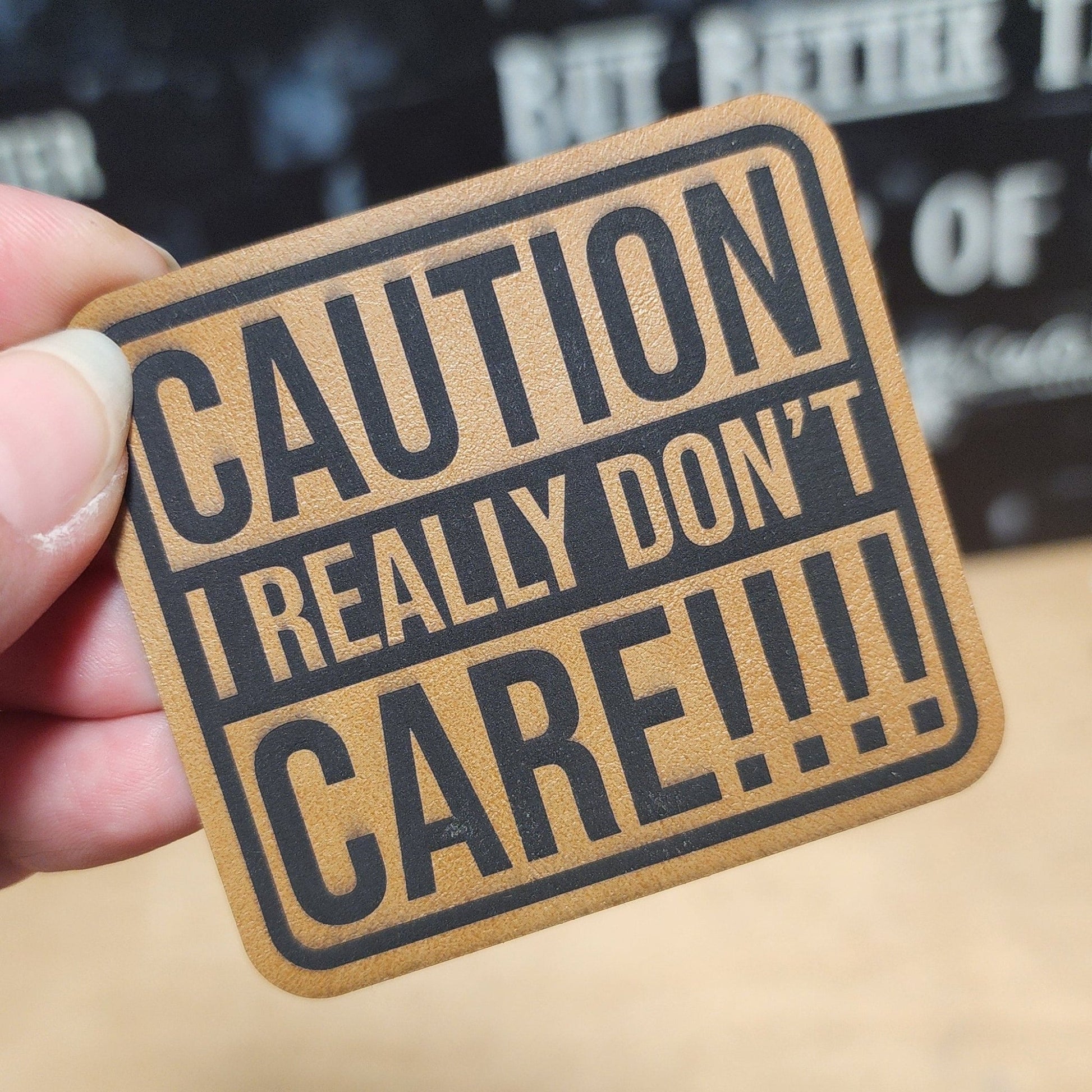 Caution: I Don't Care (Saddle Tan) Engraved Leatherette Hat Patch - MR01 - LoneStar Adhesive