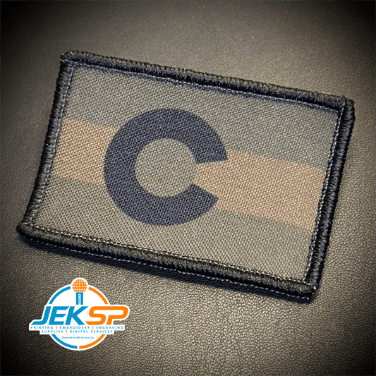Front view of Colorado State Flag patch in subdued tan and dark blue Colorado flag with C and circle emblem