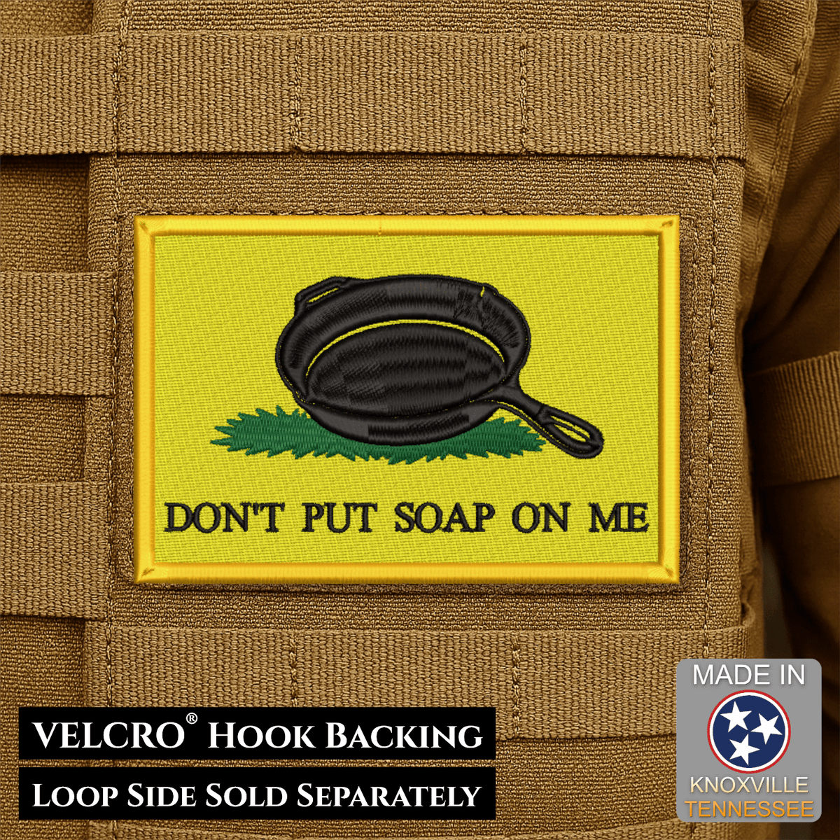 Front design and hook backing of Don't Put Soap On Me patch in yellow with a black skillet illustration and lettering