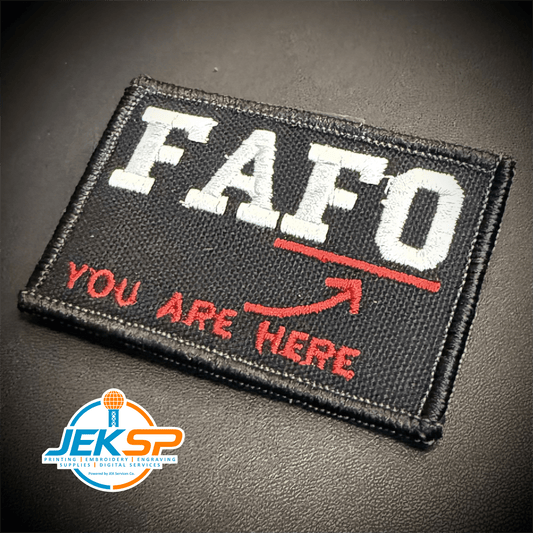 Front view of FAFO (You Are At Find Out) patch in black with white FAFO lettering and a red arrow