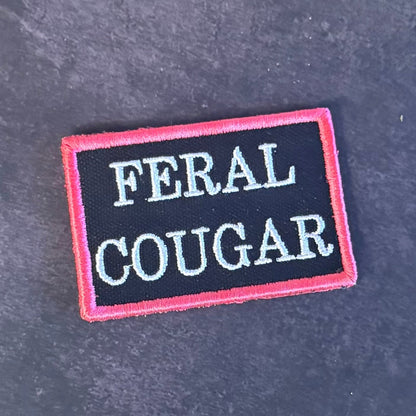 Feral Cougar Funny Morale Patch, 2x3" | Made in USA | VELCRO® Brand Hook Backing - LoneStar Adhesive