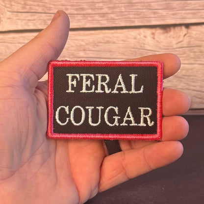 Feral Cougar Funny Morale Patch, 2x3" | Made in USA | VELCRO® Brand Hook Backing - LoneStar Adhesive