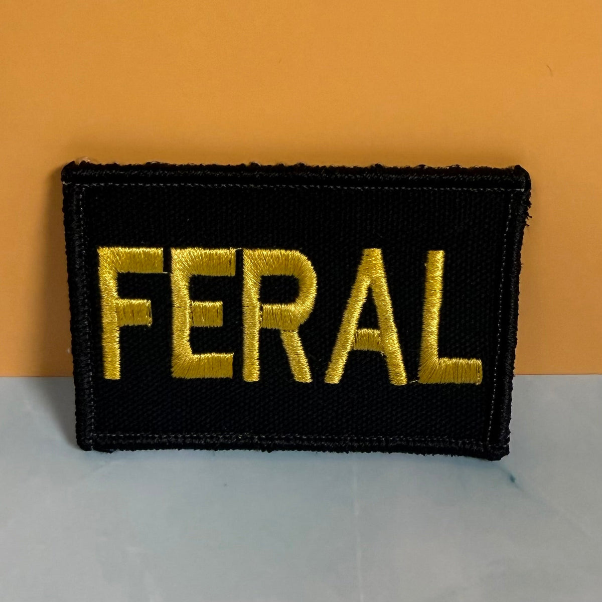 Feral & Wild Funny Morale Patch, 2x3" | Made in USA | VELCRO® Brand Hook Backing - LoneStar Adhesive