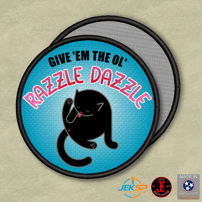 Give 'Em The Razzle Dazzle Funny Morale Patch, 3" Round | Made in USA | VELCRO® Brand Hook Backing - LoneStar Adhesive