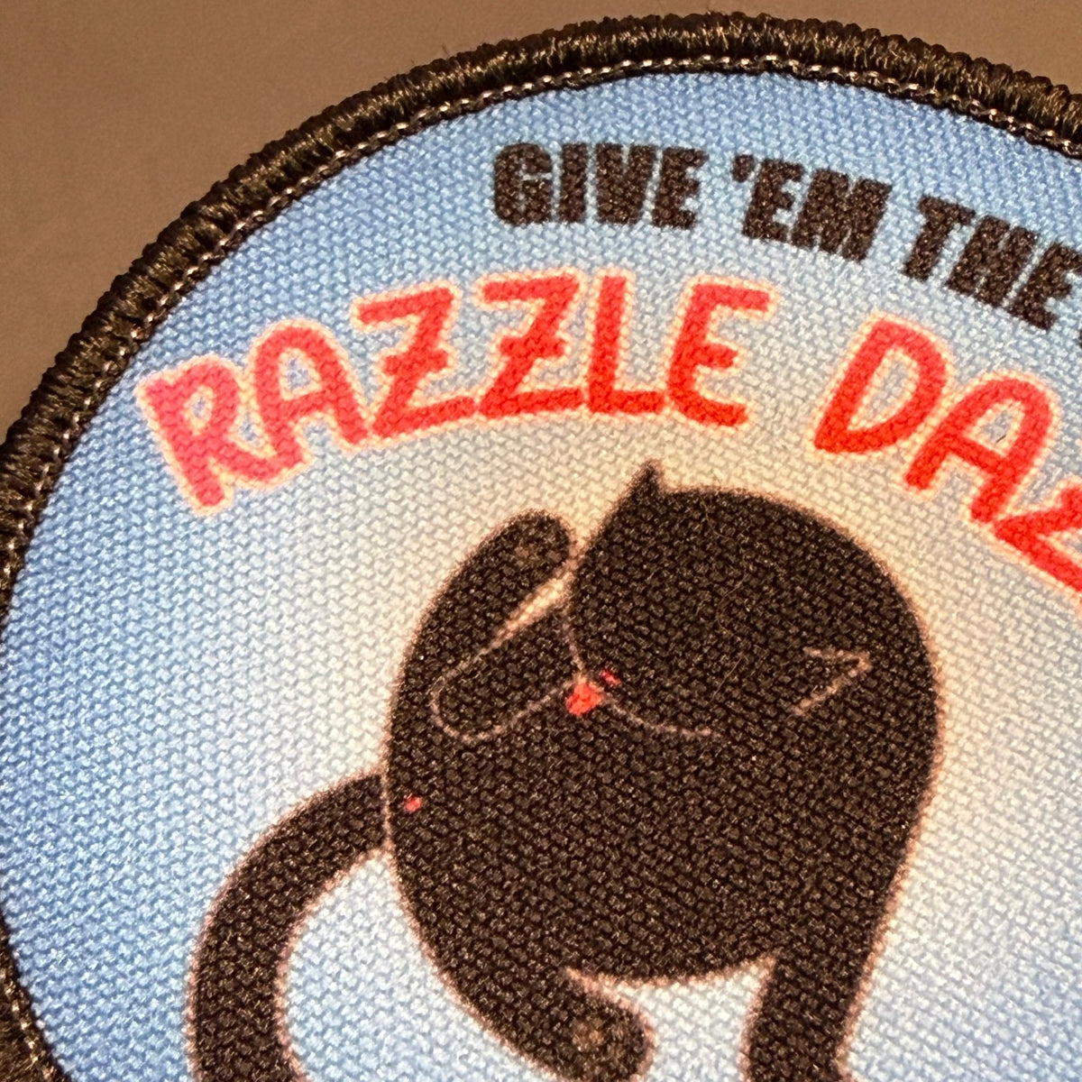 Give 'Em The Razzle Dazzle Funny Printed Morale Patch, 3" Round | VELCRO® Brand Hook Backing - #LoneStar Adhesive#