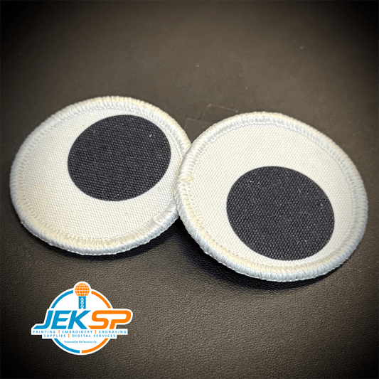 Front view of Googly Eyes Patch Set patch in two white circular eyes with black pupils