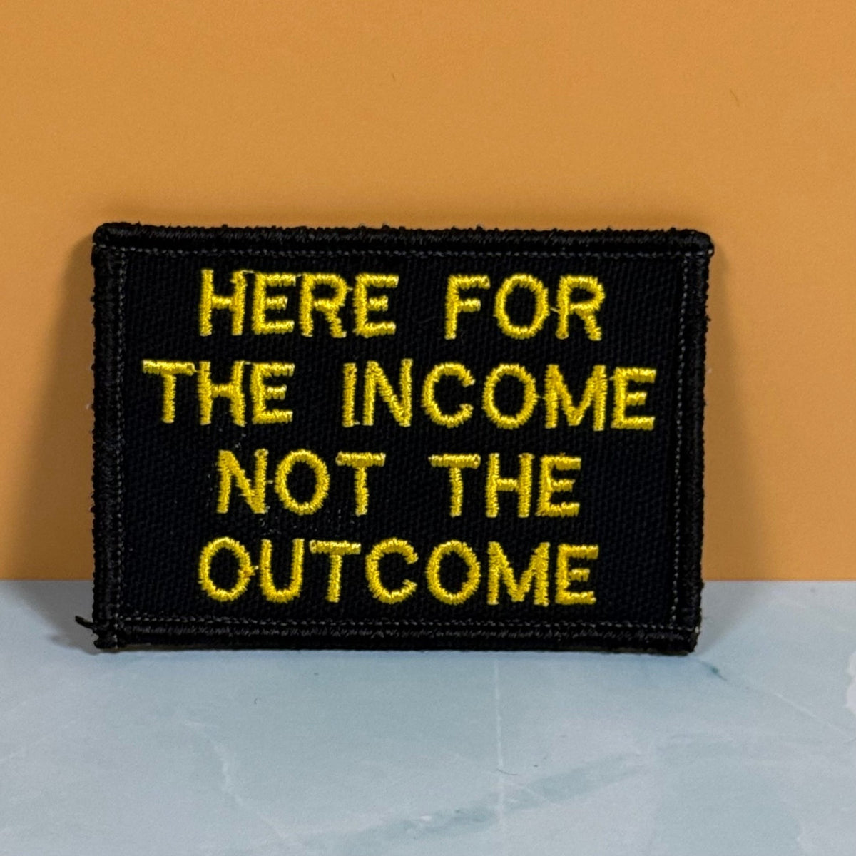 Here For The Income, Not The Outcome Funny Morale Patch, 2x3" | Made in USA | VELCRO® Brand Hook Backing - LoneStar Adhesive