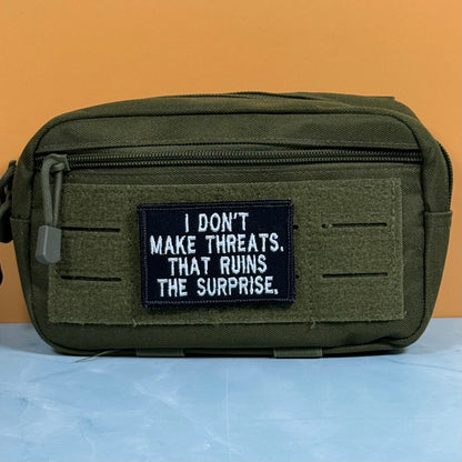 I Don't Make Threats, That Ruins The Surprise Funny Morale Patch, 2x3" | Made in USA | VELCRO® Brand Hook Backing - LoneStar Adhesive
