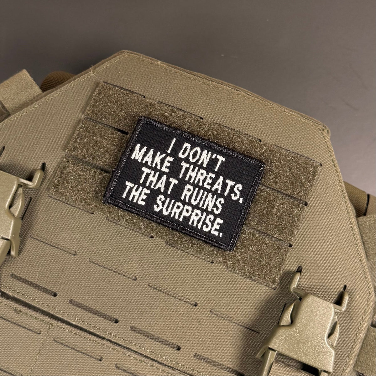I Don't Make Threats, That Ruins The Surprise Funny Morale Patch, 2x3" | Made in USA | VELCRO® Brand Hook Backing - LoneStar Adhesive