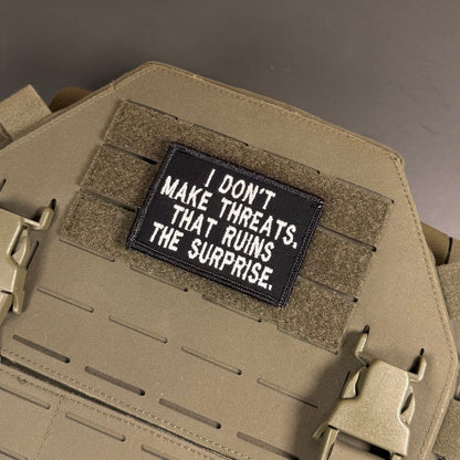 I Don't Make Threats, That Ruins The Surprise Funny Morale Patch, 2x3" | Made in USA | VELCRO® Brand Hook Backing - LoneStar Adhesive