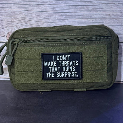 I Don't Make Threats, That Ruins The Surprise Funny Morale Patch, 2x3" | Made in USA | VELCRO® Brand Hook Backing - LoneStar Adhesive