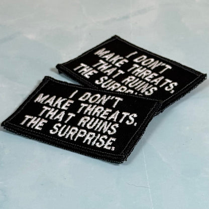 I Don't Make Threats, That Ruins The Surprise Funny Morale Patch, 2x3" | Made in USA | VELCRO® Brand Hook Backing - LoneStar Adhesive