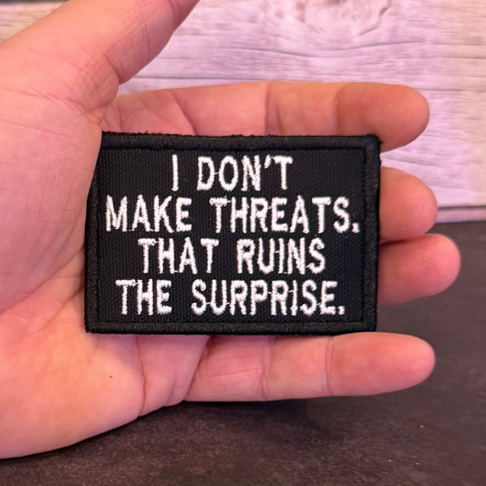 I Don't Make Threats, That Ruins The Surprise Funny Morale Patch | Made in USA | VELCRO® Brand Hook Backing - LoneStar Adhesive