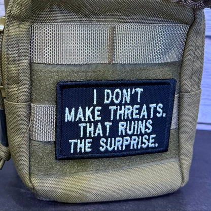 I Don't Make Threats, That Ruins The Surprise Funny Morale Patch | Made in USA | VELCRO® Brand Hook Backing - LoneStar Adhesive