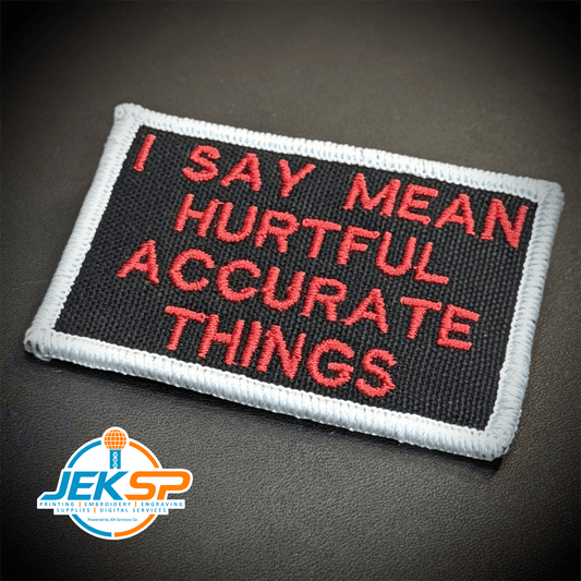 Front view of I Say Mean, Hurtful, Accurate Things patch in black with red lettering and white border