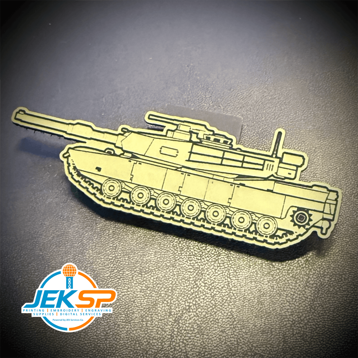 Front view of M1 Abrams Main Battle Tank patch in tan tank-shaped design with dark outlines
