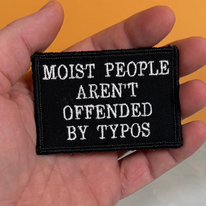 Moist People Aren’t Offended by Typos Funny Morale Patch, 2x3" | Made in USA | VELCRO® Brand Hook Backing - LoneStar Adhesive