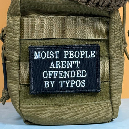 Moist People Aren’t Offended by Typos Funny Morale Patch, 2x3" | Made in USA | VELCRO® Brand Hook Backing - LoneStar Adhesive