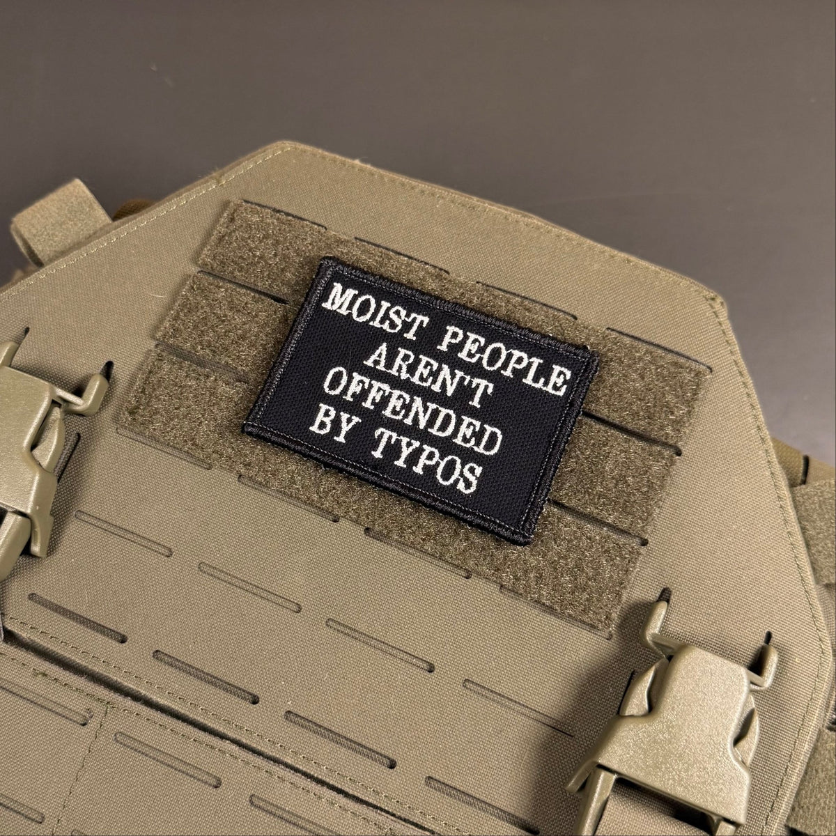 Moist People Aren’t Offended by Typos Funny Morale Patch, 2x3" | Made in USA | VELCRO® Brand Hook Backing - LoneStar Adhesive