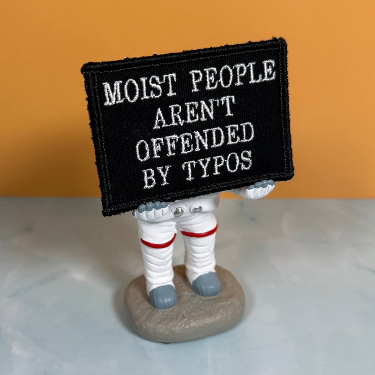 Moist People Aren’t Offended by Typos Funny Morale Patch, 2x3" | Made in USA | VELCRO® Brand Hook Backing - LoneStar Adhesive