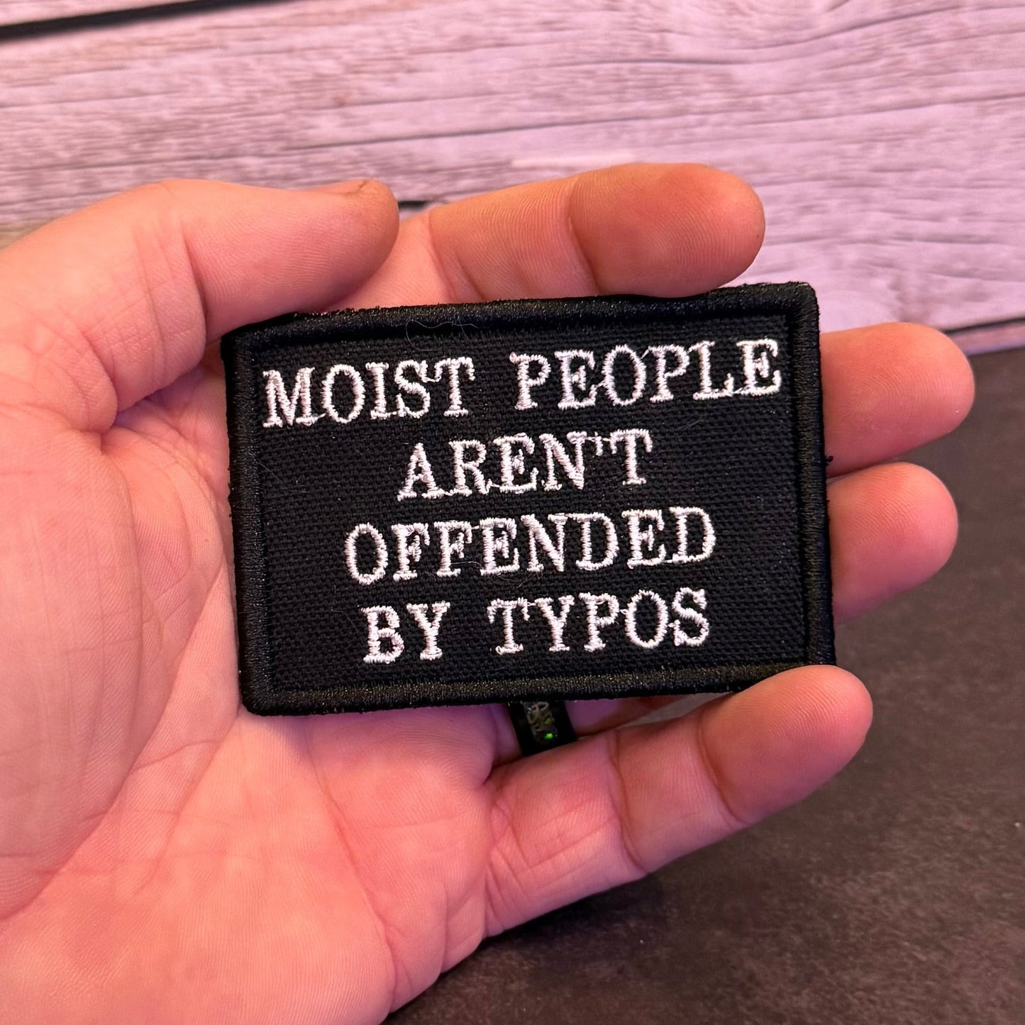 Moist People Aren’t Offended by Typos Funny Morale Patch | Made in USA | VELCRO® Brand Hook Backing - LoneStar Adhesive
