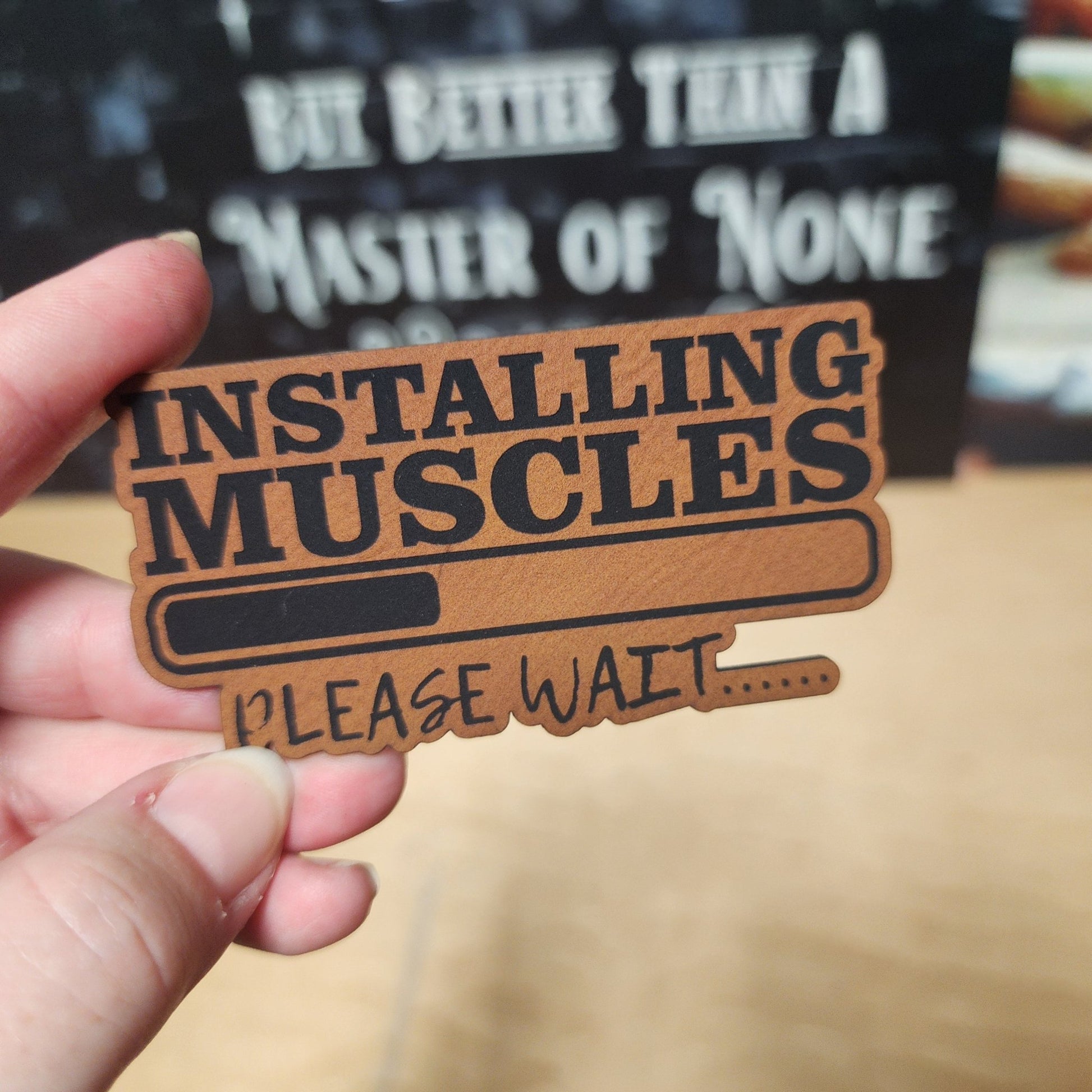 Muscle Installation In Progress (Rawhide) Engraved Leatherette Hat Patch - MR01 - LoneStar Adhesive