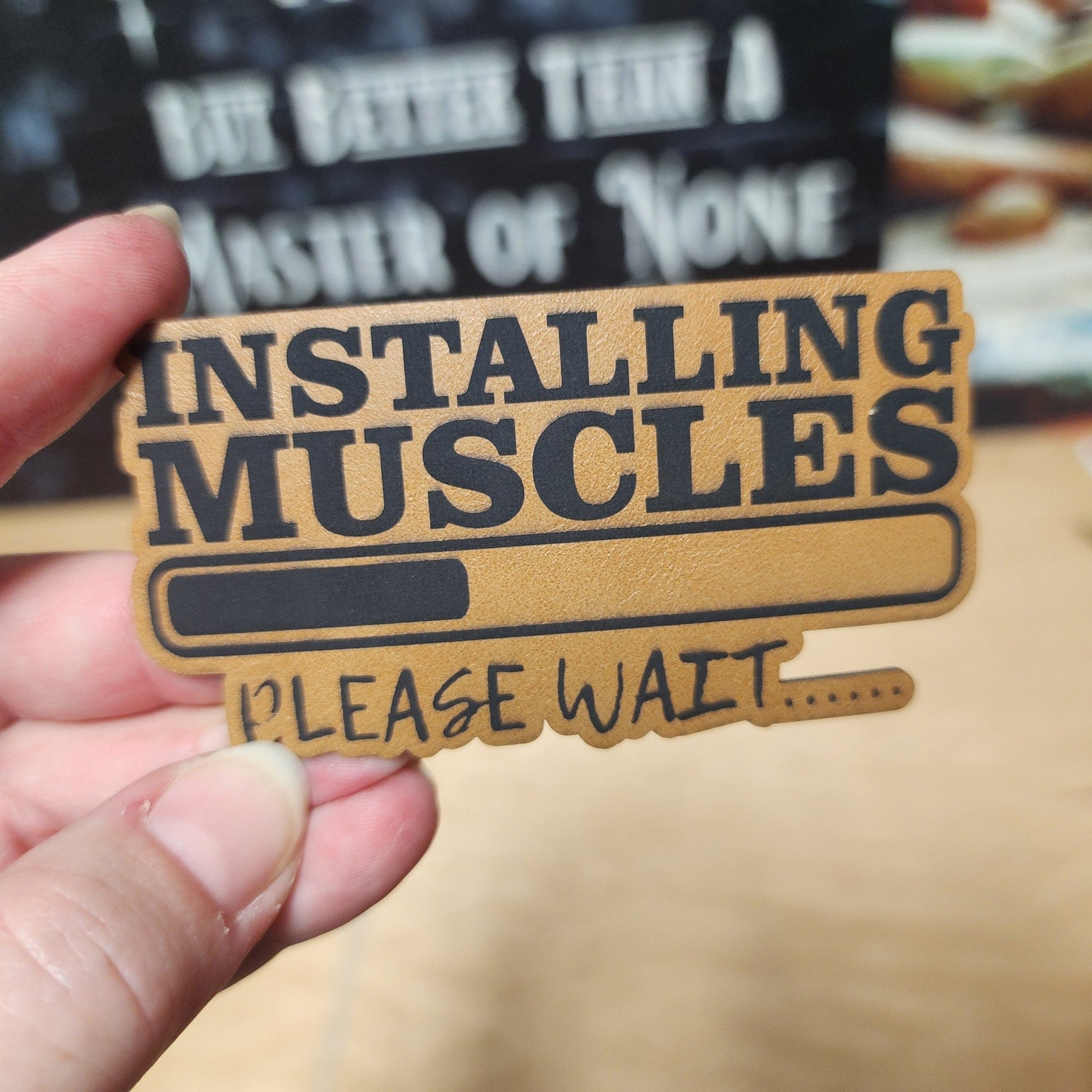 Muscle Installation In Progress (Saddle Tan) Engraved Leatherette Hat Patch - MR01 - LoneStar Adhesive