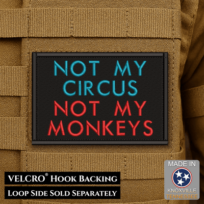 Front design and hook backing of Not My Circus, Not My Monkeys patch in black with teal and red lettering