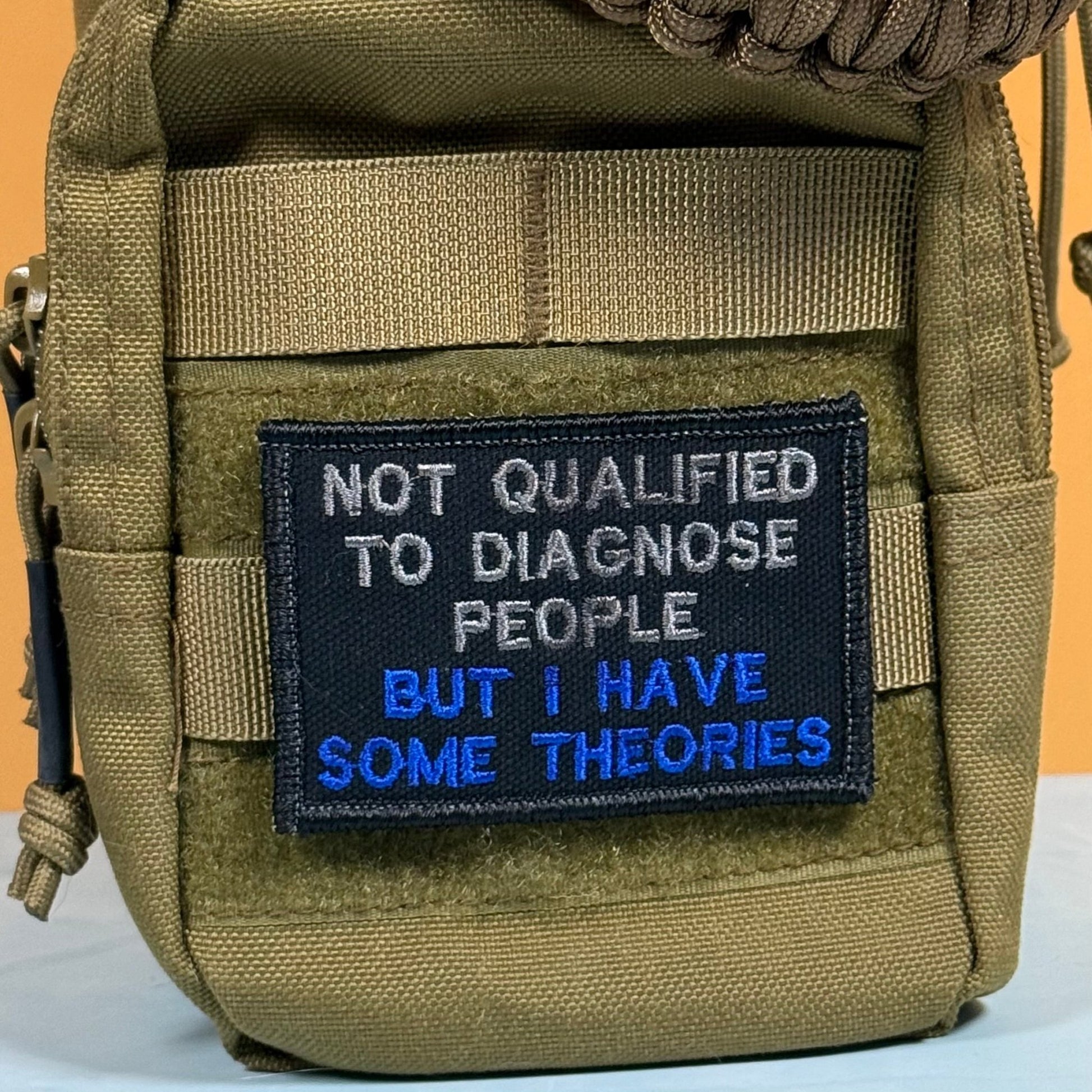 Not Qualified to Diagnose People, But I Have Theories Funny Morale Patch, 2x3" | Made in USA | VELCRO® Brand Hook Backing - LoneStar Adhesive