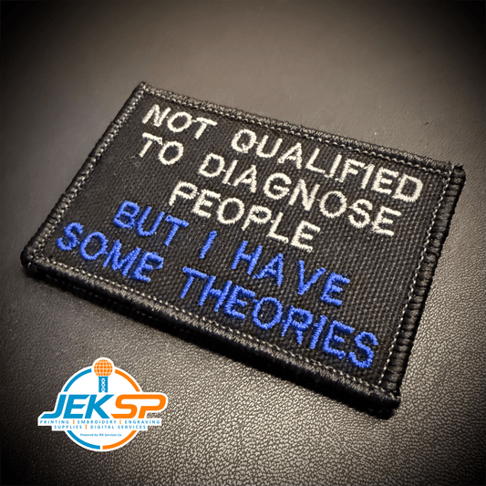 Front view of Not Qualified to Diagnose People, But I Have Theories patch in black with white and blue lettering
