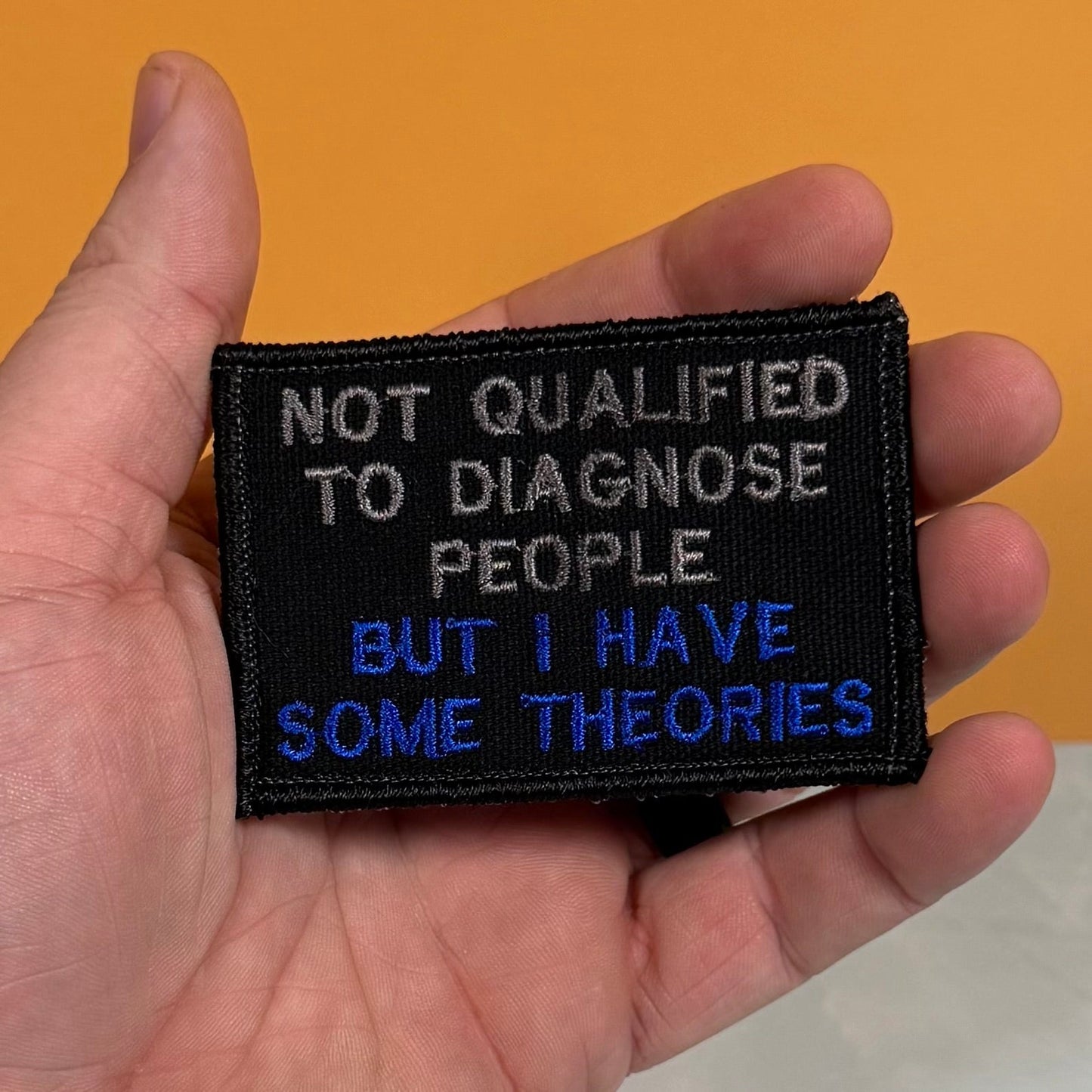 Not Qualified to Diagnose People, But I Have Theories Funny Morale Patch, 2x3" | Made in USA | VELCRO® Brand Hook Backing - LoneStar Adhesive