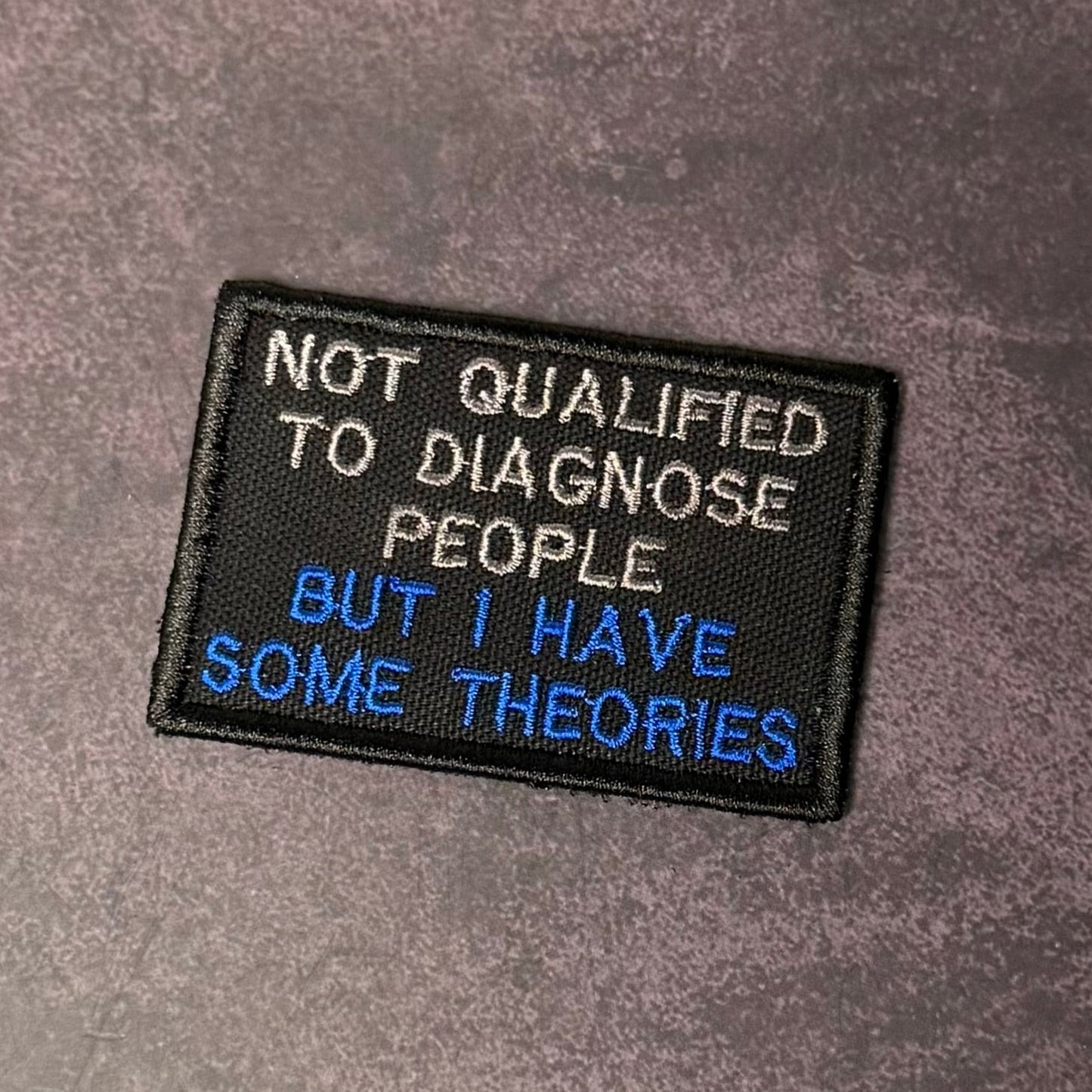 Not Qualified to Diagnose People, But I Have Theories Funny Morale Patch | Made in USA | VELCRO® Brand Hook Backing - LoneStar Adhesive